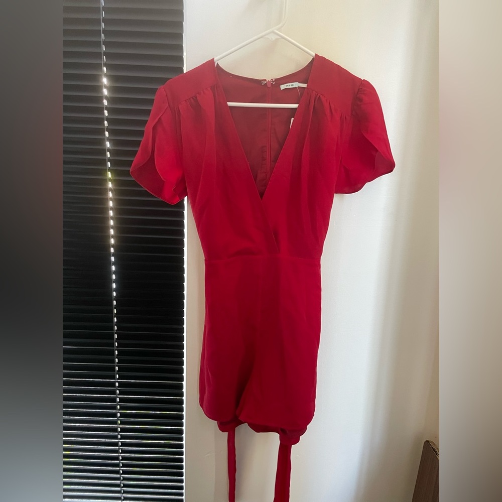 Red romper from Urban Outfitters. Size 4. Never been worn.